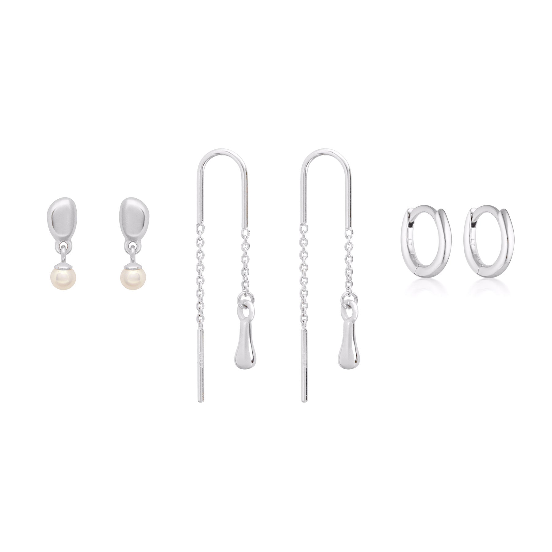Bundle of sterling silver earrings including stud, thread and huggie earrings.