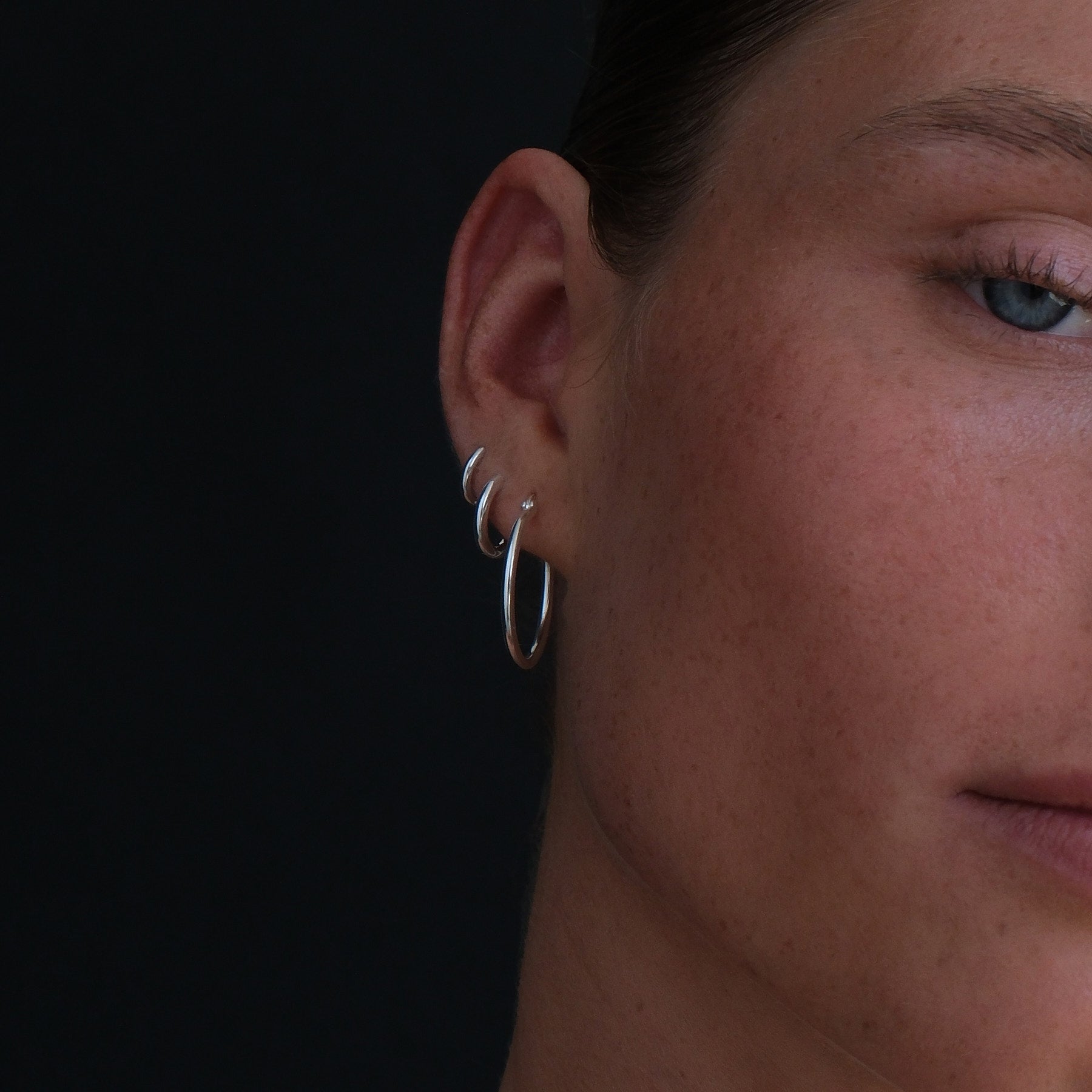 Close up of model wearing hoop stack.