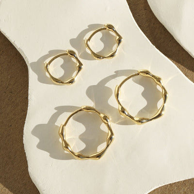Organica Mini Huggie Earrings Gold Flat Lay
