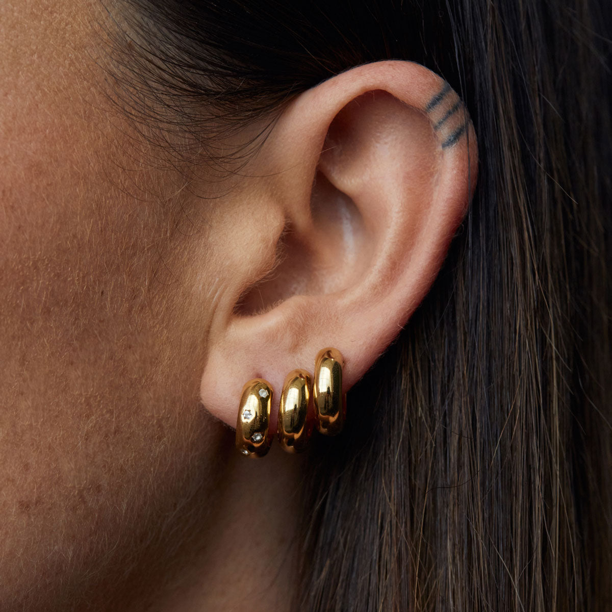 Solar Huggie Earrings Gold Campaign