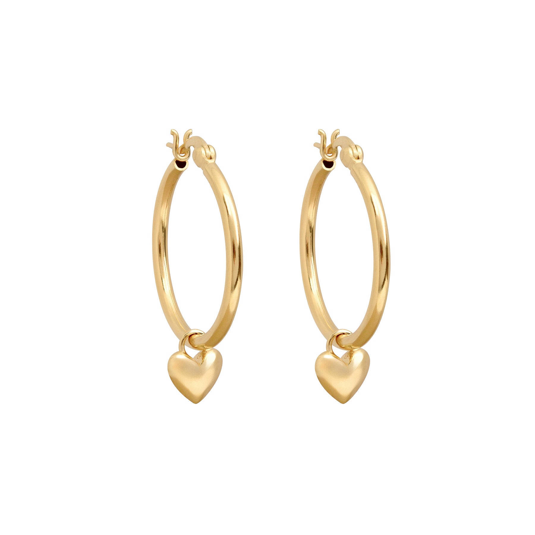 Close up image of gold hoop with heart charm.