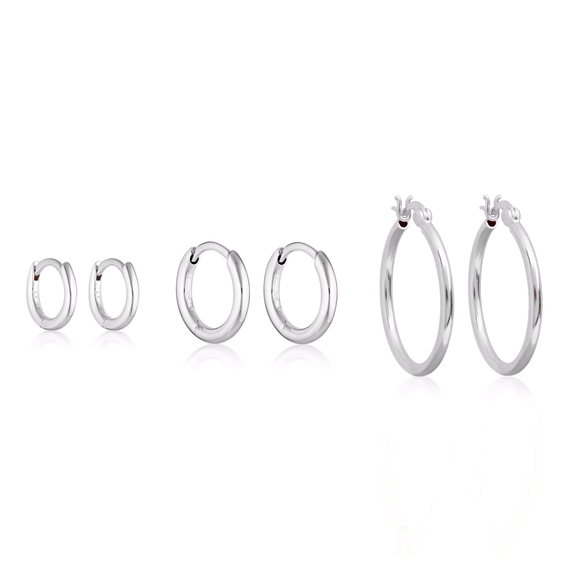 Bundle of sterling silver hoop earrings.