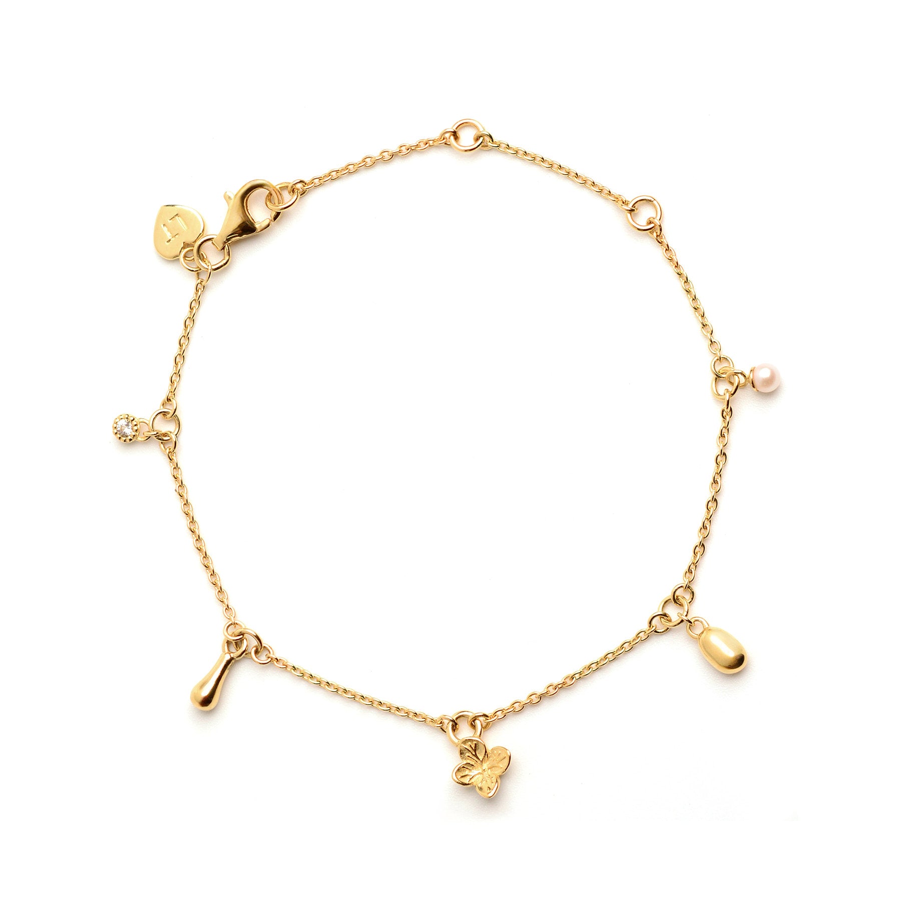 Image of an 18k gold plated five charm bracelet including a flower, pearl and organic shaped charms.