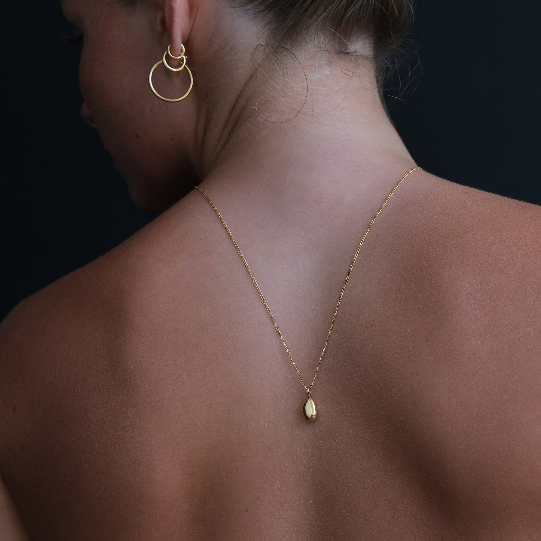 Image of model wearing an 18k gold vermeil necklace