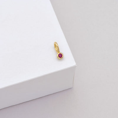 Tiny Ruby Charm - 9k Gold